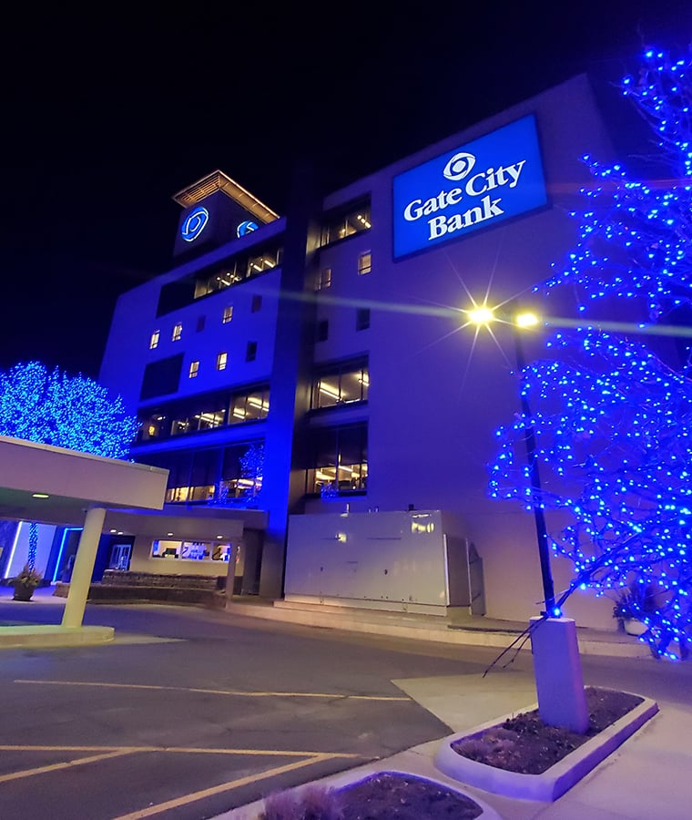 Beautiful evening view of Gate City Bank’s blue lights during the holiday season in downtown Fargo, ND